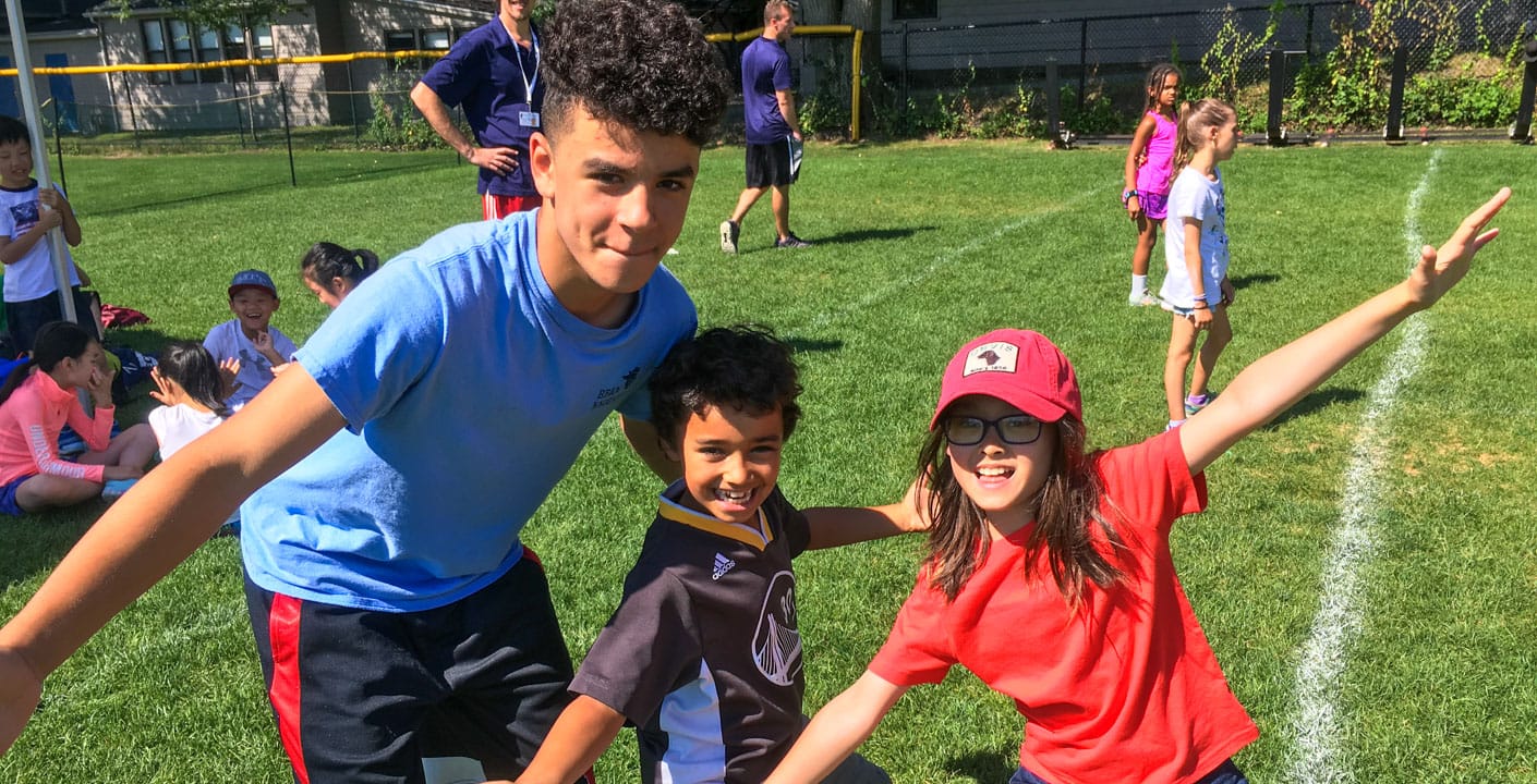 Campers and staff on sports field